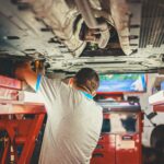 Mechanic fixing car